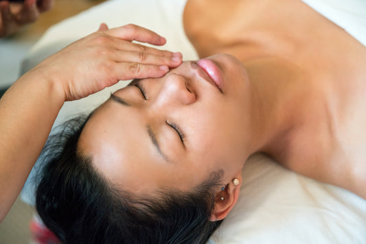 Young women receiving a face massage