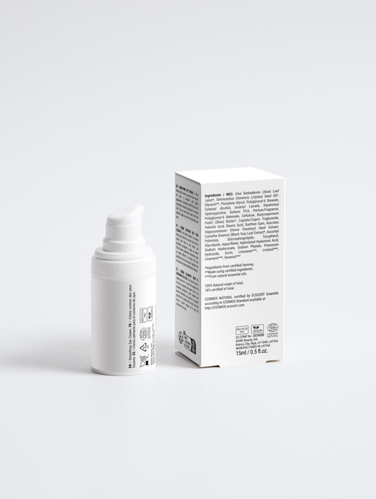 White skincare product and its packaging on a light gray background