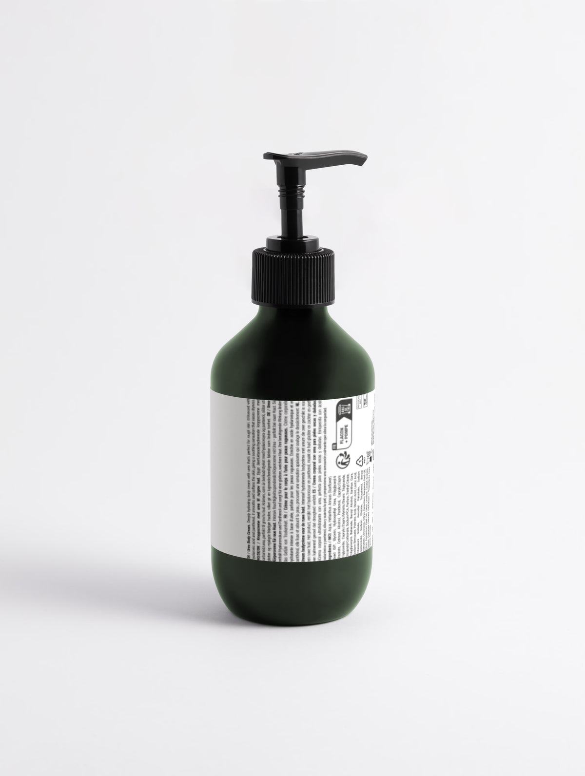 Green bottle with pump and label on a white background