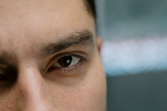 This is a picture of a man focusing on his left eye