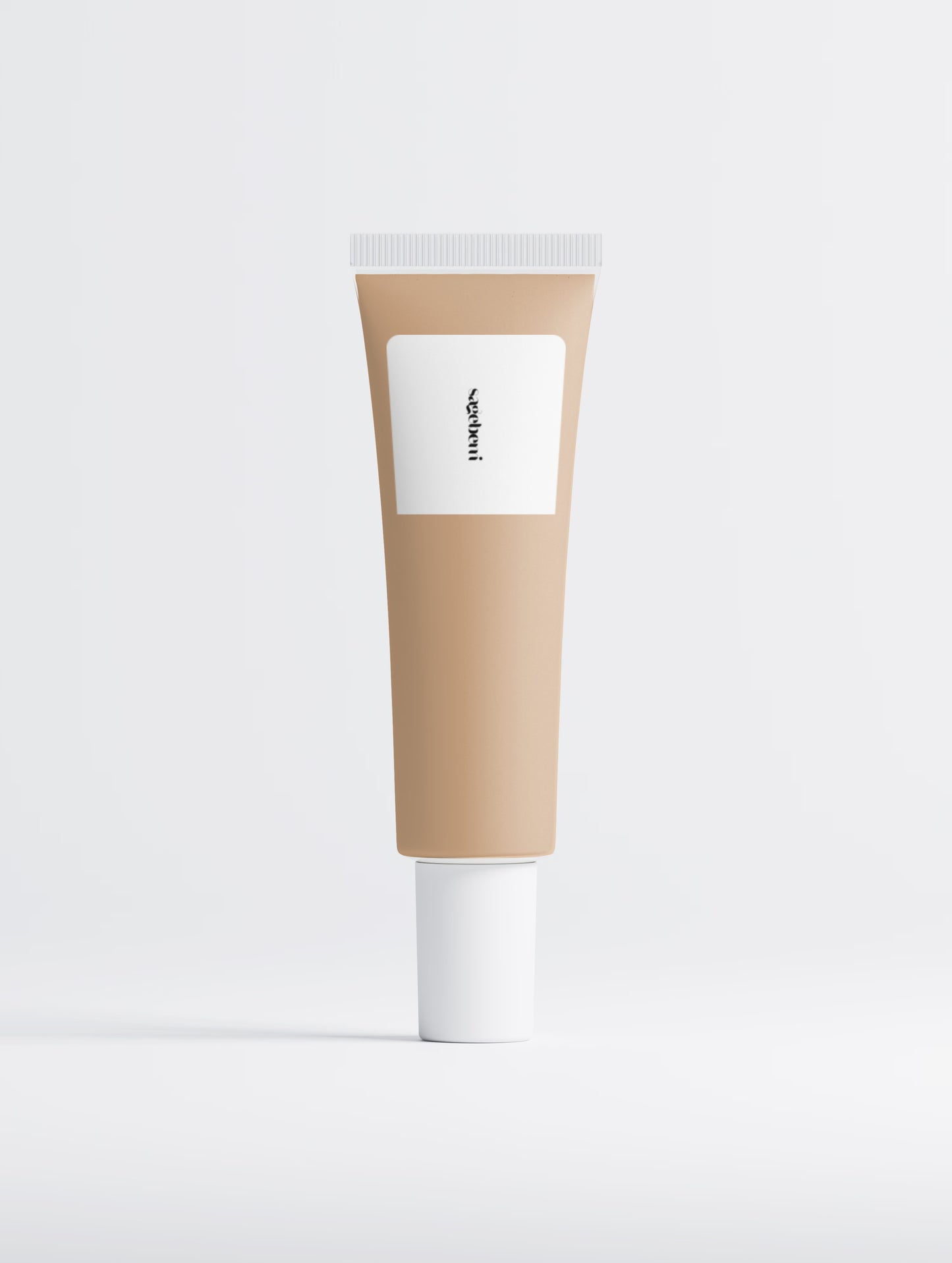 A blank cosmetic tube with a warm beige body, a white rectangular label, and a white cap, centered on a light gray background.