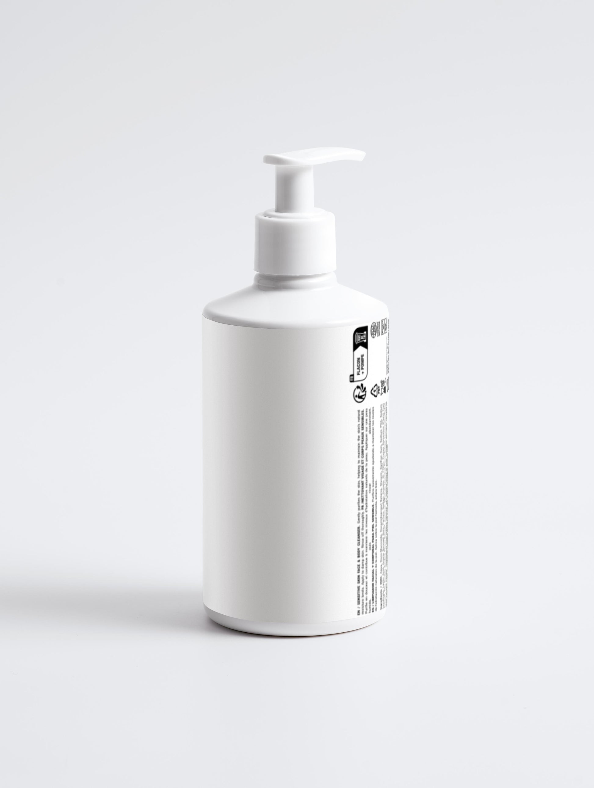 White bottle with pump on a light gray background